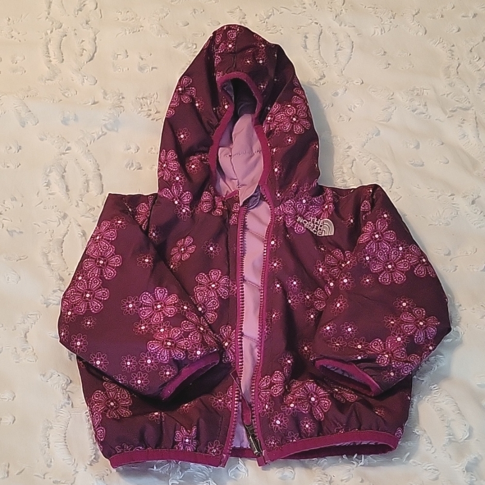 Infant reversible North Face jacket. 6 to 12 month size. Purple and pink.